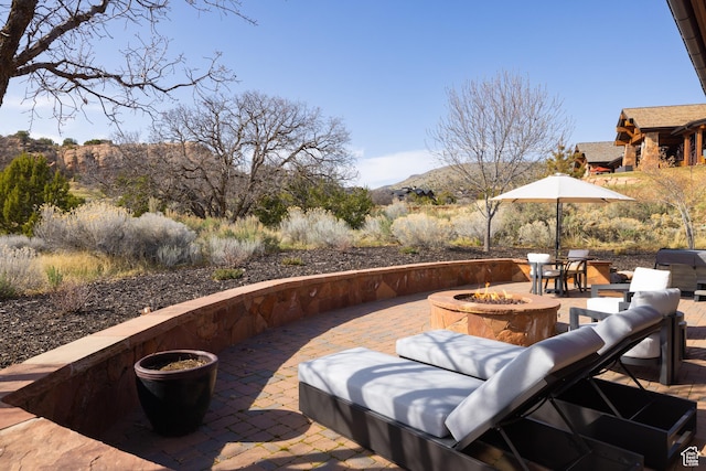 181 N Club Cabins Ct, Heber City, UT 84032 - view of patio with an outdoor fire pit and a mountain view