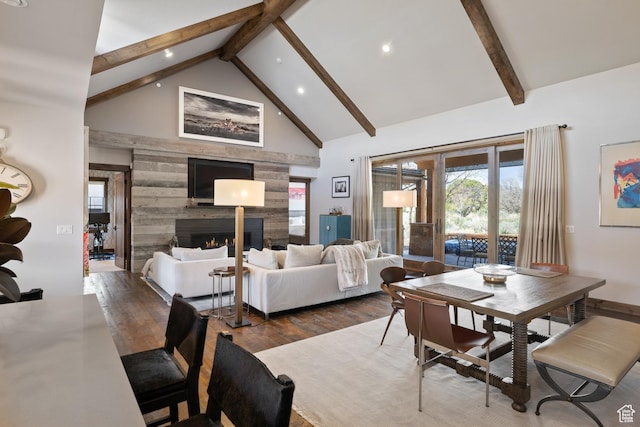 181 N Club Cabins Ct, Heber City, UT 84032 - dining room featuring recessed lighting, wood finished floors, a warm lit fireplace, and beamed ceiling