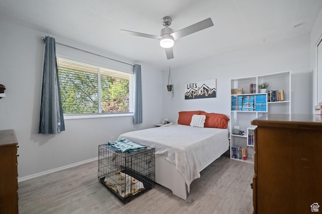 9968 S Blossom Dr, Sandy, UT 84092 - bedroom featuring wood finished floors, baseboards, and a ceiling fan