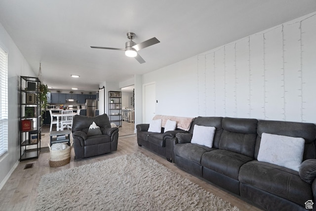 9968 S Blossom Dr, Sandy, UT 84092 - living room with wood finished floors and a ceiling fan