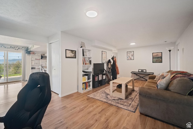 9968 S Blossom Dr, Sandy, UT 84092 - living room with light wood-type flooring and baseboards