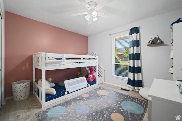 9968 S Blossom Dr, Sandy, UT 84092 - bedroom featuring wood finished floors, baseboards, and ceiling fan