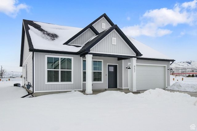 167 N 950 E Unit 33, Tremonton, UT 84337 - view of front facade with a garage and board and batten siding