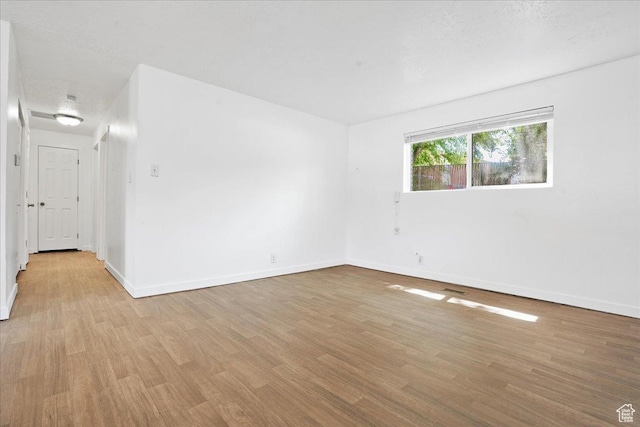 218 E Julie Anna Dr, Sandy, UT 84070 - unfurnished room featuring baseboards and light wood finished floors