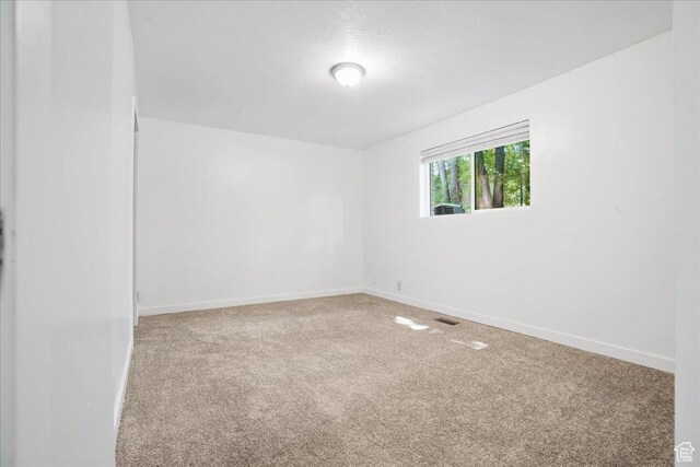 218 E Julie Anna Dr, Sandy, UT 84070 - carpeted empty room featuring baseboards