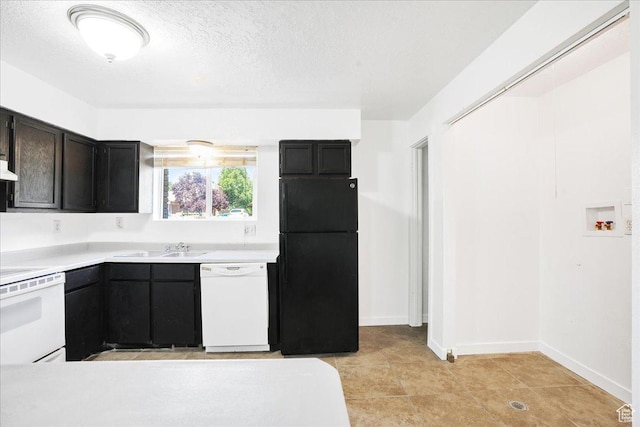 218 E Julie Anna Dr, Sandy, UT 84070 - kitchen featuring a sink, white appliances, light countertops, a textured ceiling, and baseboards