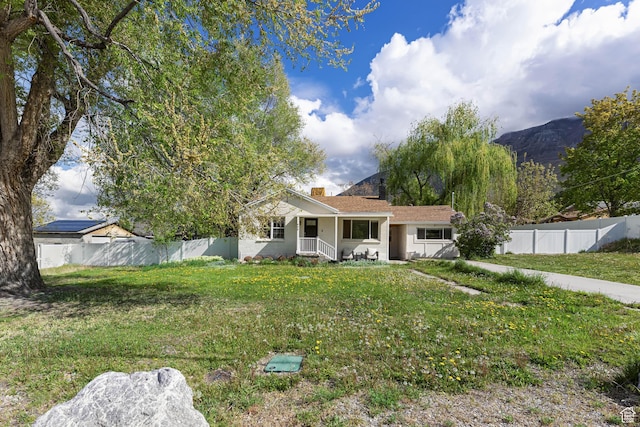 605 E 700 N, Pleasant Grove, UT 84062 - view of front of property featuring fence private yard, a chimney, a porch, and a front yard