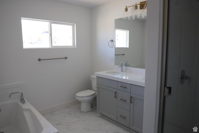 full bathroom featuring a bath, vanity, baseboards, toilet, and marble finish floor