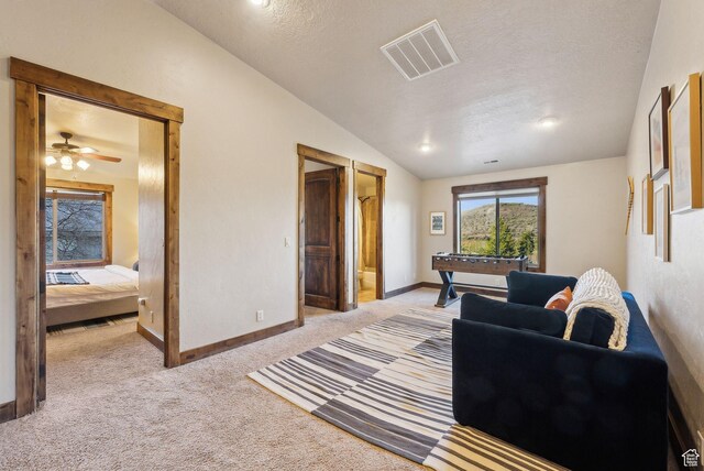 210 Parkview Dr, Summit Park, UT 84098 - living room with ceiling fan, a textured ceiling, visible vents, lofted ceiling, and light carpet