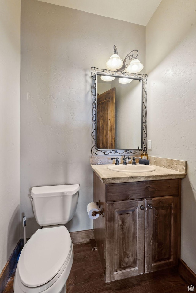 210 Parkview Dr, Summit Park, UT 84098 - bathroom featuring vanity, baseboards, toilet, and wood finished floors