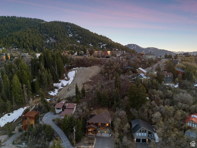 210 Parkview Dr, Summit Park, UT 84098 - aerial view at dusk featuring a view of trees and a mountain view