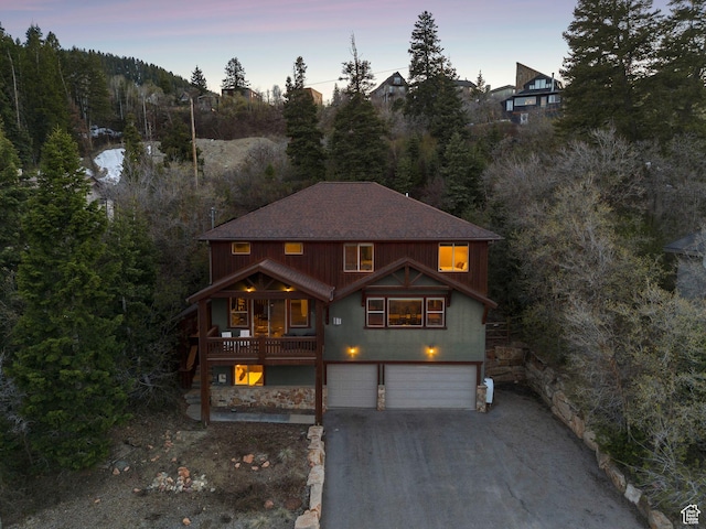 210 Parkview Dr, Summit Park, UT 84098 - rustic home with an attached garage and aphalt driveway