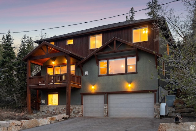 210 Parkview Dr, Summit Park, UT 84098 - rustic home with concrete driveway, a balcony, stone siding, and a garage