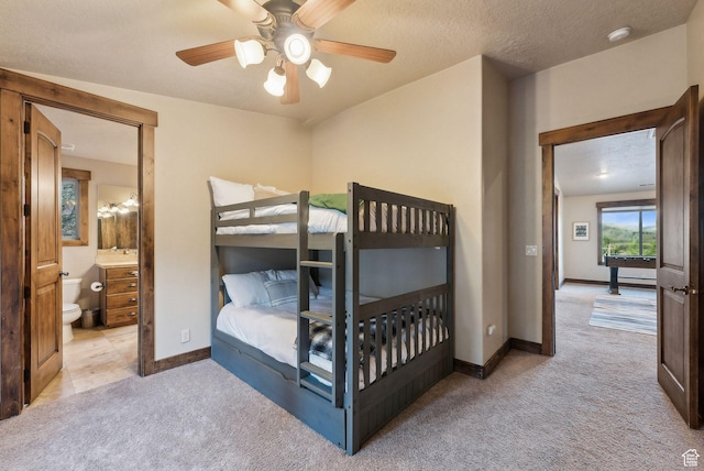 210 Parkview Dr, Summit Park, UT 84098 - carpeted bedroom with baseboards, a ceiling fan, and ensuite bathroom