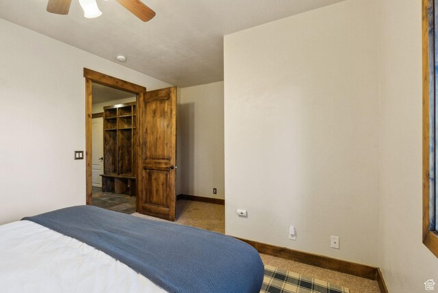 210 Parkview Dr, Summit Park, UT 84098 - carpeted bedroom featuring baseboards, ceiling fan, and a spacious closet
