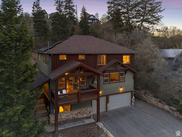 210 Parkview Dr, Summit Park, UT 84098 - view of front of property featuring a garage, a shingled roof, concrete driveway, and solar panels