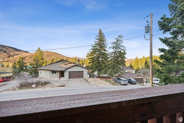 210 Parkview Dr, Summit Park, UT 84098 - exterior space with driveway, a mountain view, and a garage