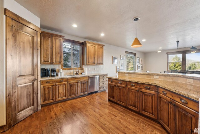 210 Parkview Dr, Summit Park, UT 84098 - kitchen featuring light stone countertops, a sink, recessed lighting, wood finished floors, and stainless steel dishwasher