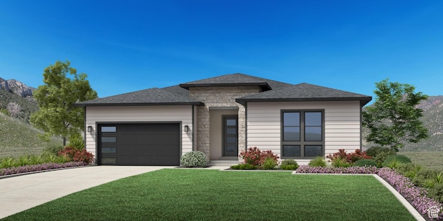 prairie-style home with driveway, roof with shingles, a front lawn, an attached garage, and stone siding