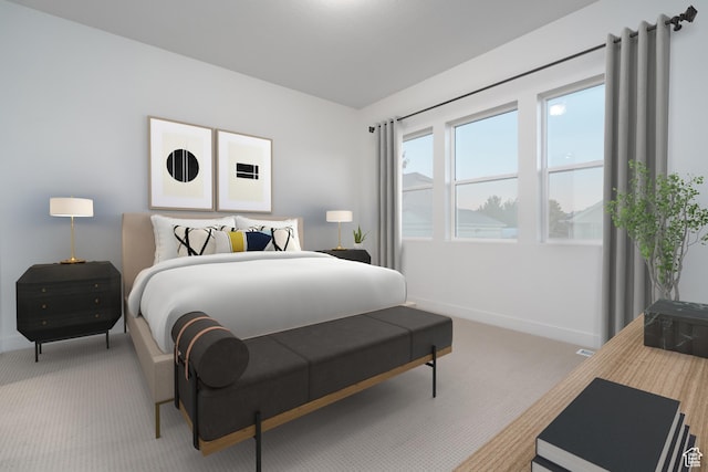 bedroom featuring baseboards and light carpet