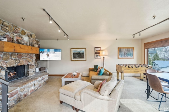 1386 Pinnacle Dr Unit 82, Park City, UT 84060 - carpeted living area featuring track lighting, a fireplace, and baseboard heating