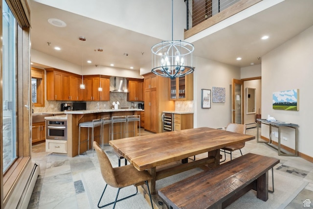 1386 Pinnacle Dr Unit 82, Park City, UT 84060 - dining room featuring a baseboard heating unit, recessed lighting, beverage cooler, and a chandelier