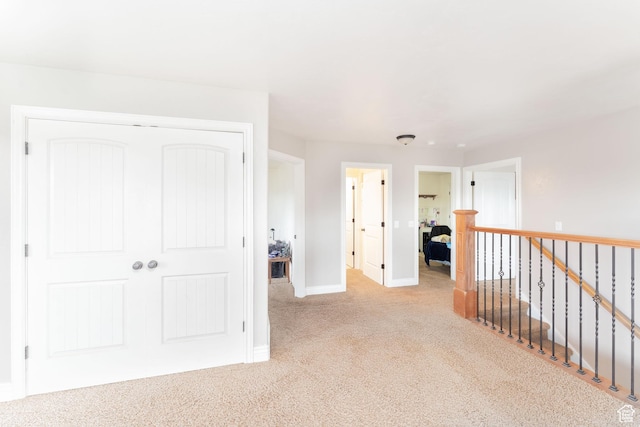 4231 W 650 N, Vernal, UT 84078 - corridor featuring baseboards, light colored carpet, and an upstairs landing
