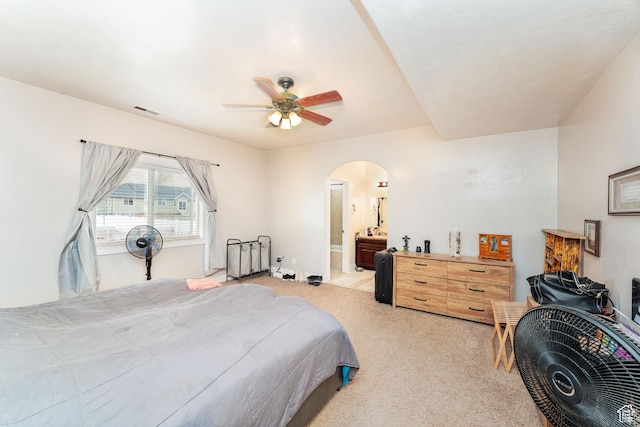 4231 W 650 N, Vernal, UT 84078 - bedroom with connected bathroom, ceiling fan, light carpet, arched walkways, and visible vents