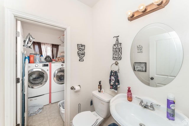 4231 W 650 N, Vernal, UT 84078 - half bath featuring separate washer and dryer, toilet, a sink, and tile patterned floors