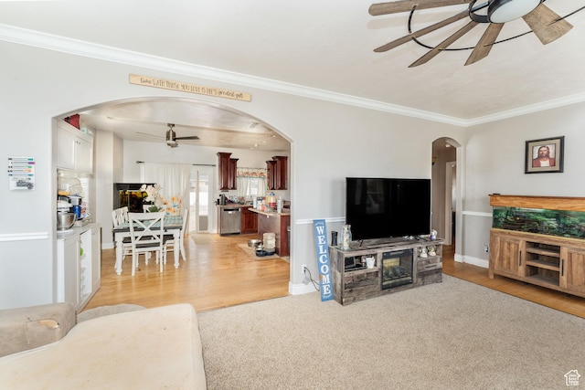 4231 W 650 N, Vernal, UT 84078 - living area featuring crown molding, a ceiling fan, arched walkways, and light wood-type flooring