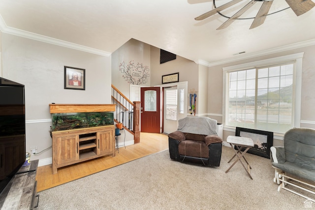 4231 W 650 N, Vernal, UT 84078 - carpeted living room with a ceiling fan, baseboards, wood finished floors, ornamental molding, and stairway