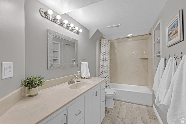 2137 W 550 N, West Point, UT 84015 - bathroom featuring shower / bath combination with curtain, visible vents, wood finished floors, vanity, and toilet
