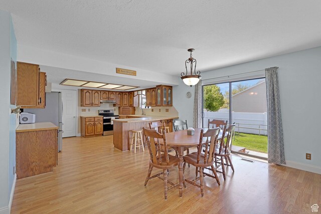 2137 W 550 N, West Point, UT 84015 - dining room with baseboards, light wood finished floors, and visible vents