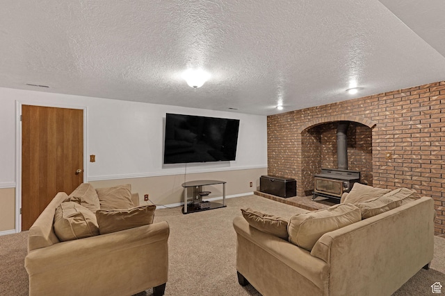 2137 W 550 N, West Point, UT 84015 - living area featuring a wood stove, brick wall, baseboards, a textured ceiling, and carpet flooring