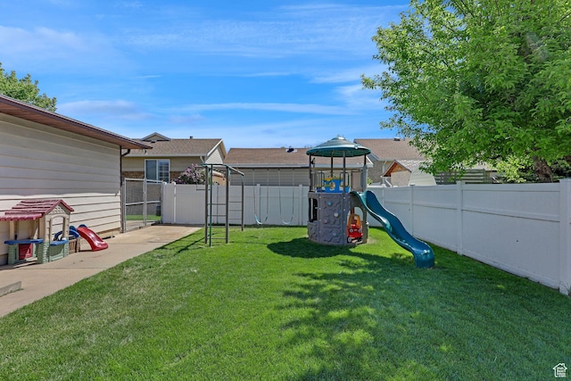 2137 W 550 N, West Point, UT 84015 - view of yard with a fenced backyard and a playground