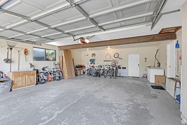 2137 W 550 N, West Point, UT 84015 - garage with a garage door opener and fridge