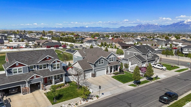drone / aerial view with a mountain view and a residential view
