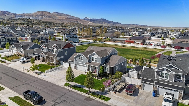 drone / aerial view featuring a residential view and a mountain view
