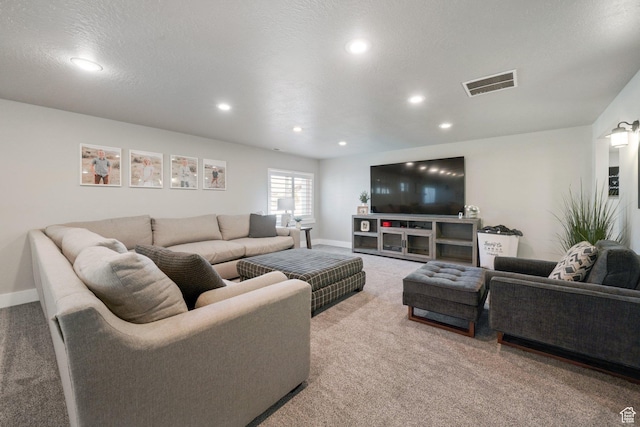carpeted living room with visible vents, recessed lighting, and baseboards