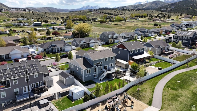 birds eye view of property featuring a mountain view and a residential view
