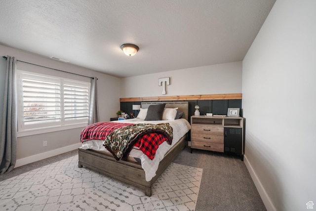 bedroom featuring visible vents, carpet flooring, and baseboards