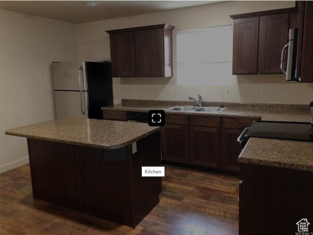 204 N 750 E, Vineyard, UT 84059 - kitchen with freestanding refrigerator, stainless steel microwave, a sink, and dark wood-type flooring