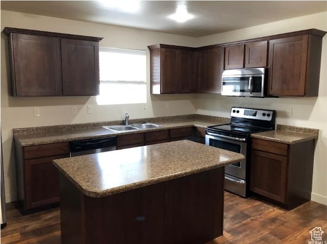 204 N 750 E, Vineyard, UT 84059 - kitchen featuring dark brown cabinetry, a sink, dark wood finished floors, a center island, and stainless steel appliances