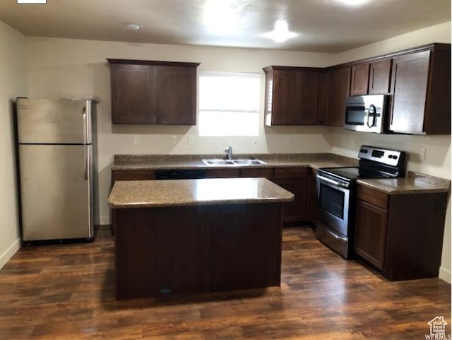 204 N 750 E, Vineyard, UT 84059 - kitchen with dark brown cabinetry, appliances with stainless steel finishes, a sink, and a center island