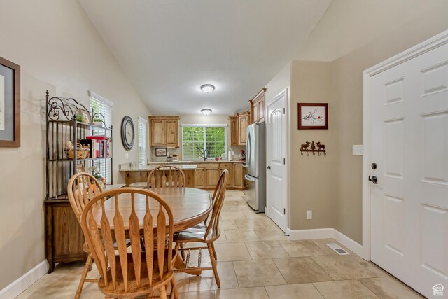1155 S 2880 E, Spanish Fork, UT 84660 - dining space featuring baseboards, vaulted ceiling, light tile patterned flooring, and visible vents