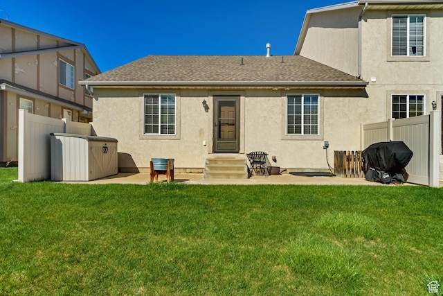 1155 S 2880 E, Spanish Fork, UT 84660 - rear view of property featuring a yard, fence, a shingled roof, and stucco siding