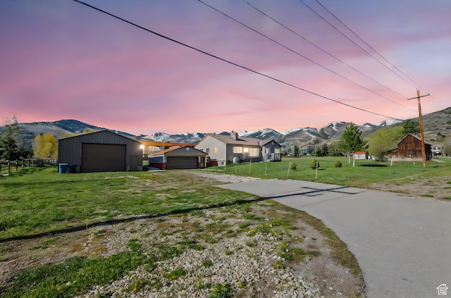 1745 Old Ranch Rd, Park City, UT 84098 - view of front facade with driveway, a front yard, a residential view, an outbuilding, and fence