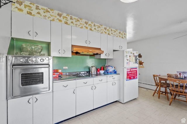 1745 Old Ranch Rd, Park City, UT 84098 - kitchen featuring electric cooktop, stainless steel oven, freestanding refrigerator, light floors, and under cabinet range hood
