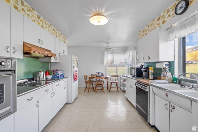 1745 Old Ranch Rd, Park City, UT 84098 - kitchen featuring appliances with stainless steel finishes, light countertops, extractor fan, white cabinetry, and a baseboard heating unit