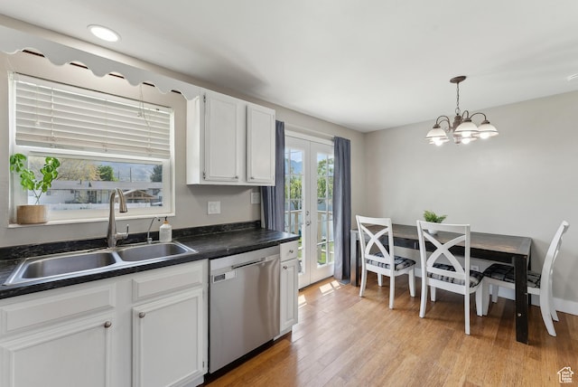 222 N 600th St E, Orem, UT 84097 - kitchen featuring a sink, dark countertops, a notable chandelier, and dishwasher